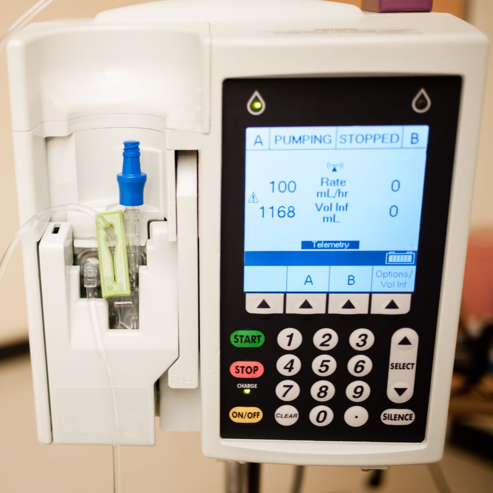 Shows a closeup of an IV infusion pump
